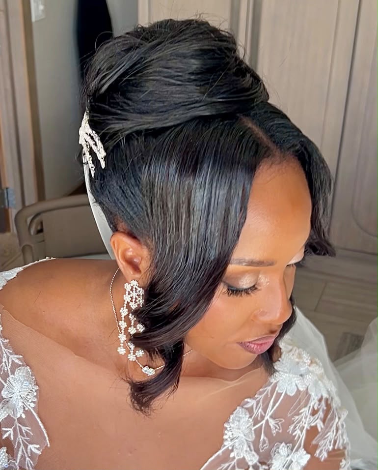 Polished silk-press bridal pin-up with a jewelled clip