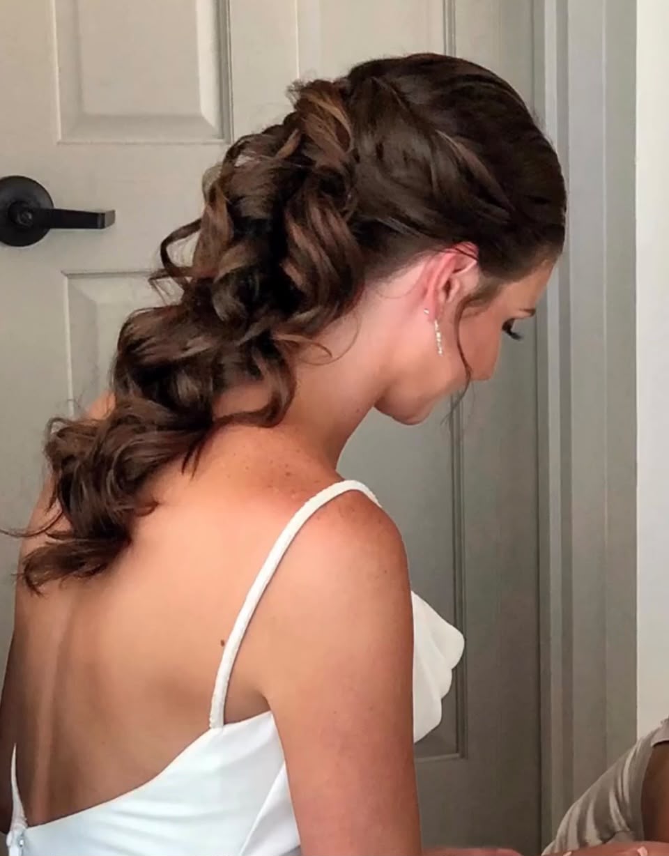 Curled low ponytail bridal style
